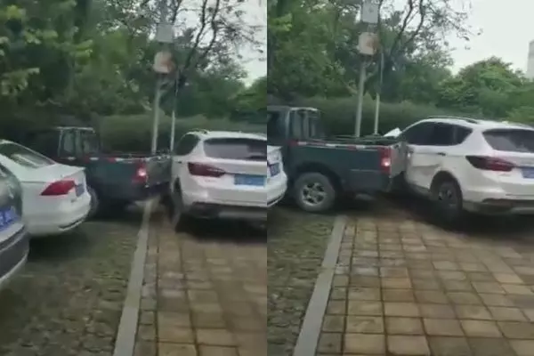不忿被違停轎車擋路 貨卡倒車11次撞開它