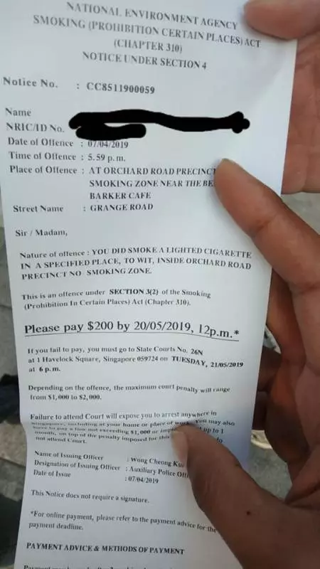 在吸菸區抽菸 一隻腳踩出線 中罰單